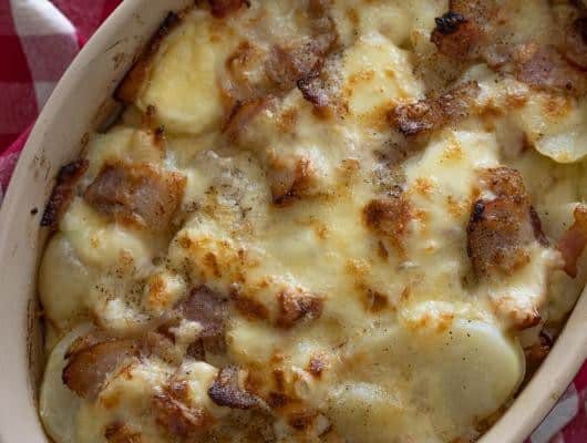 Bacon, Onion, Raclette Potato Gratin winter potato dish rich in bacon, onions, and melting cheese