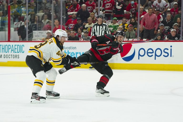 Hurricanes use flurry of late goals to beat Bruins in Game 1