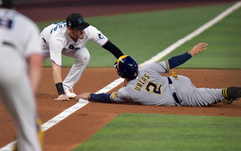Marlins score runs in bunches, blast past Brewers