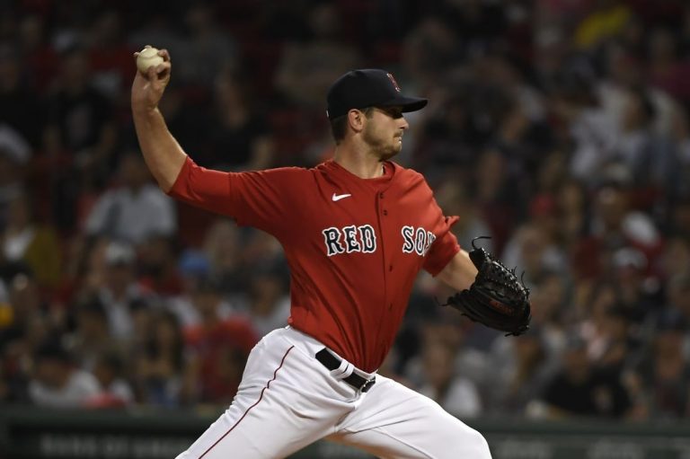 MLB Orioles score 10 runs in late innings to turn back Red Sox