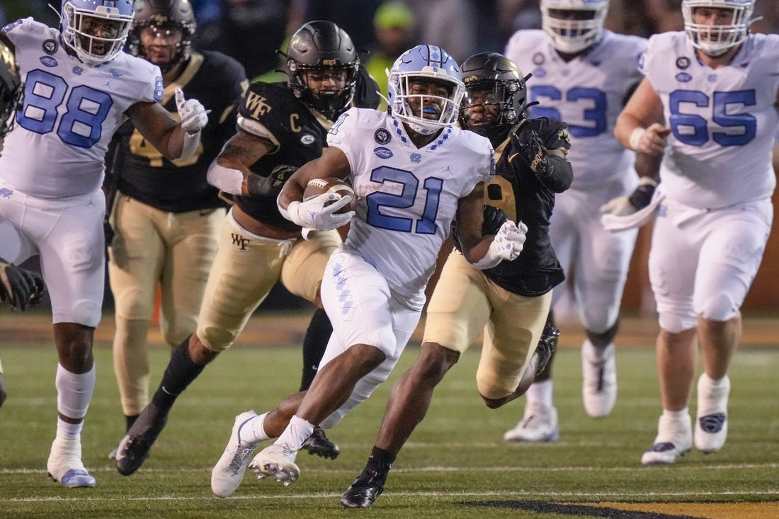 NCAAF News: No. 15 UNC clinches division title with narrow win over Wake Forest