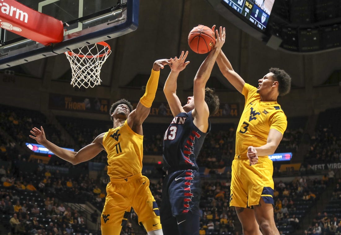 Bob Huggins moves into tie for 3rd in wins as WVU routs Penn