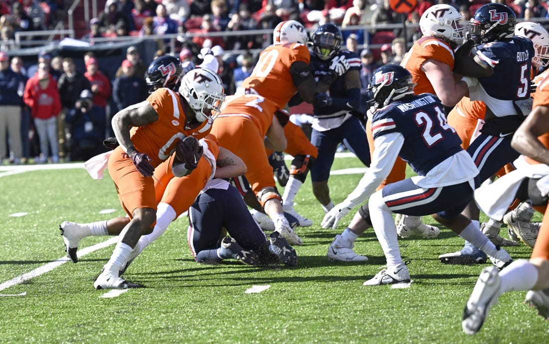NCAAF News: Virginia Tech edges Liberty, halts seven-game skid