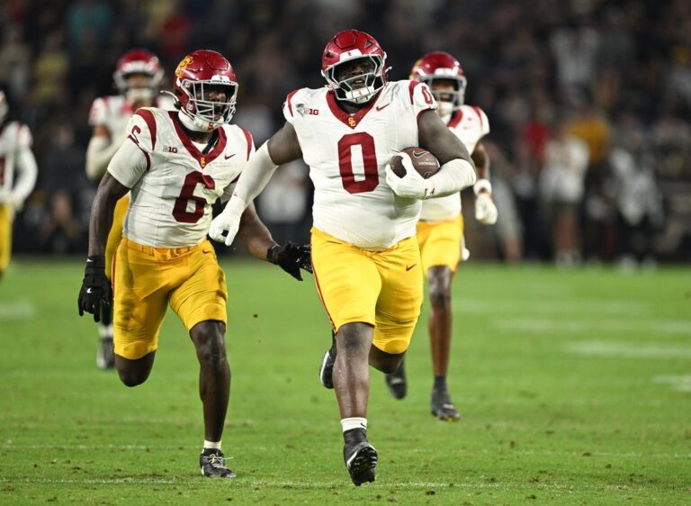 NCAAF News: After extended delay, USC opens Big Ten play with win at Purdue